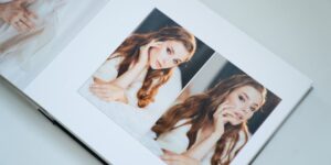 A photo book featuring two images of a woman posing in different settings.